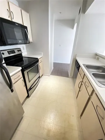 a kitchen with a stove and a microwave