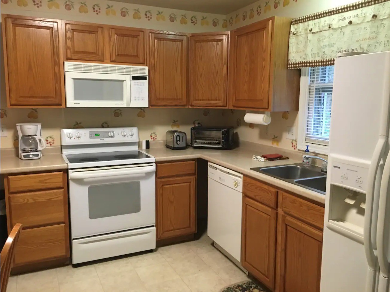107 Kinneys Road Springfield, TN 37172 - Photo 10 of 24 a kitchen with stainless steel appliances granite countertop white cabinets sink and a granite counter top