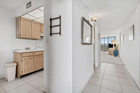 a kitchen with a refrigerator and cabinets