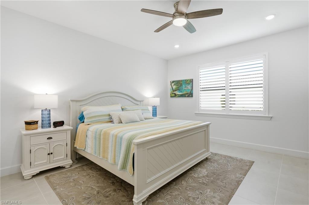 18364 Ridgeline Drive Estero, FL 33928 - Photo 20 of 50 a bedroom with a bed and window