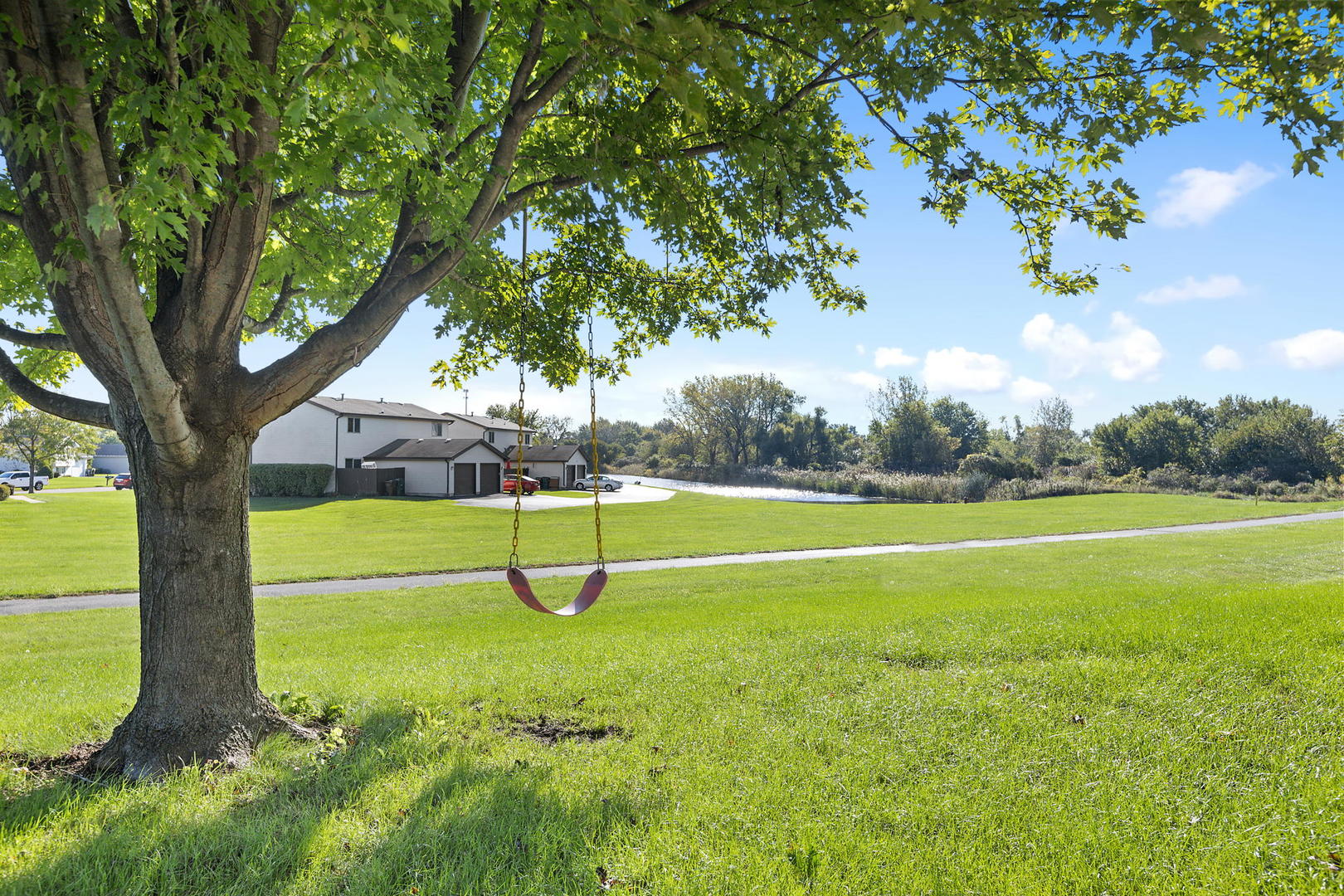 778 Lake Road, Unit 778 New Lenox, IL 60451 - Photo 2 of 16 a view of a playground with a slide