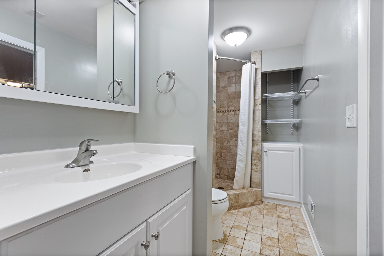 778 Lake Road, Unit 778 New Lenox, IL 60451 - Photo 12 of 16 a bathroom with a sink a toilet and shower