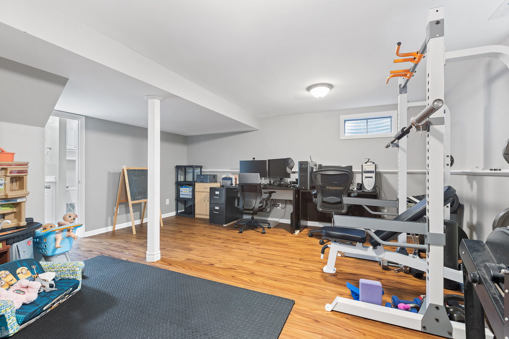 778 Lake Road, Unit 778 New Lenox, IL 60451 - Photo 13 of 16 a room with lots of gym equipment and wooden floor
