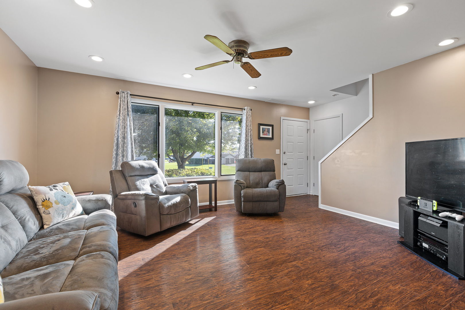778 Lake Road, Unit 778 New Lenox, IL 60451 - Photo 3 of 16 a living room with furniture and a flat screen tv