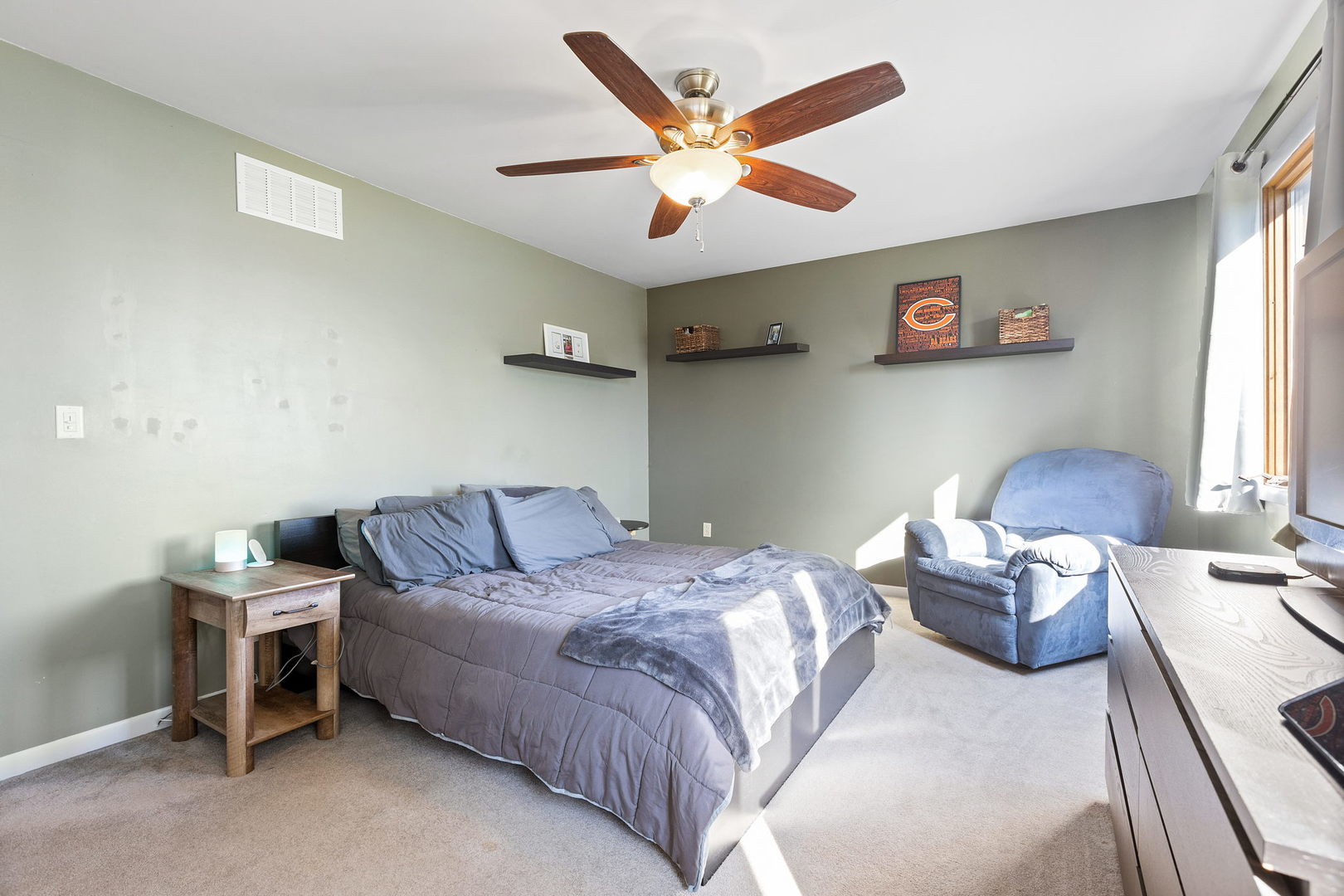 778 Lake Road, Unit 778 New Lenox, IL 60451 - Photo 8 of 16 a bedroom with a bed and a chandelier