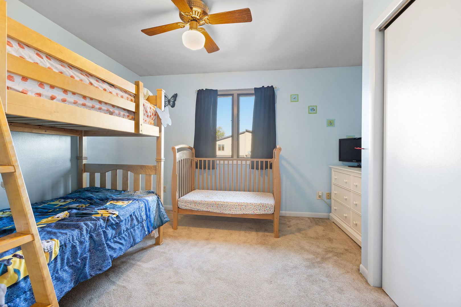 778 Lake Road, Unit 778 New Lenox, IL 60451 - Photo 10 of 16 a bedroom with a bed and a chandelier