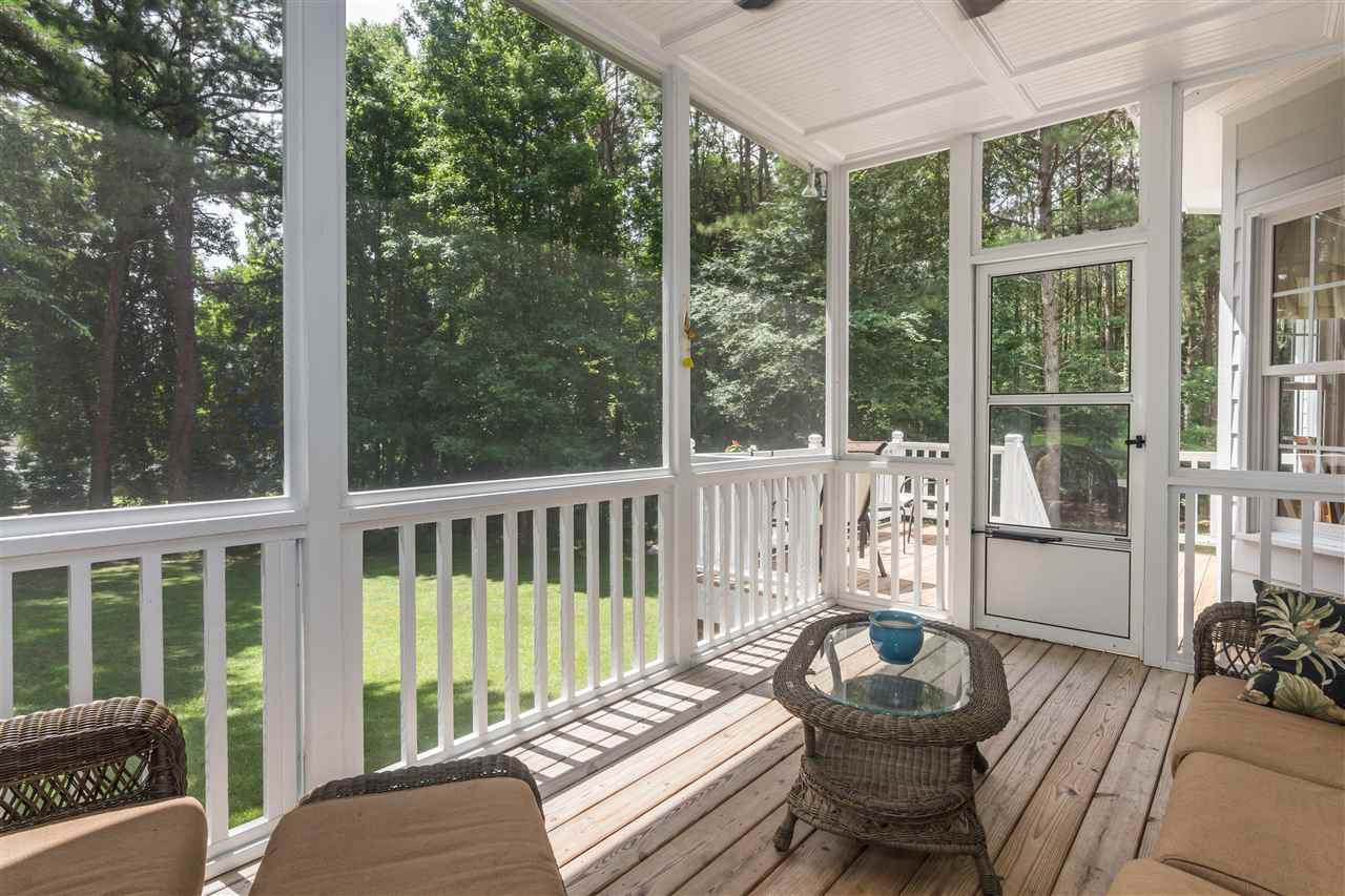 1132 Rhea Drive Garner, NC 27529 - Photo 20 of 25 Sit on your lovely screened porch and enjoy your coffee (or a glass of wine!) while overlooking the spacious (.7 acres!) wooded backyard. Screened Porch
