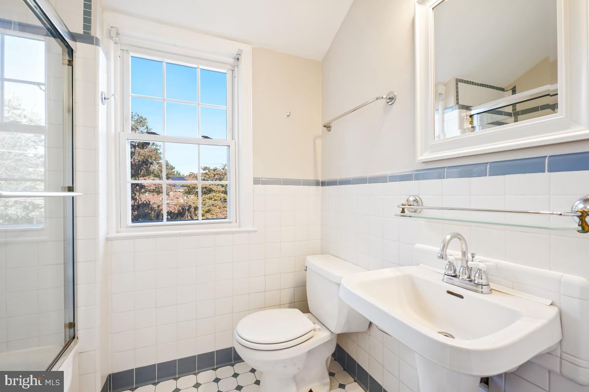 2806 Ivydale Street Silver Spring, MD 20902 - Photo 14 of 29 a bathroom with a sink a toilet and a mirror