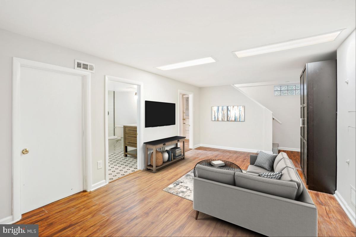 2806 Ivydale Street Silver Spring, MD 20902 - Photo 19 of 29 a living room with furniture and a flat screen tv