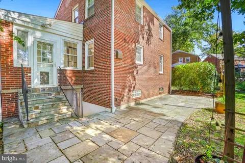 a view of a brick house with a street