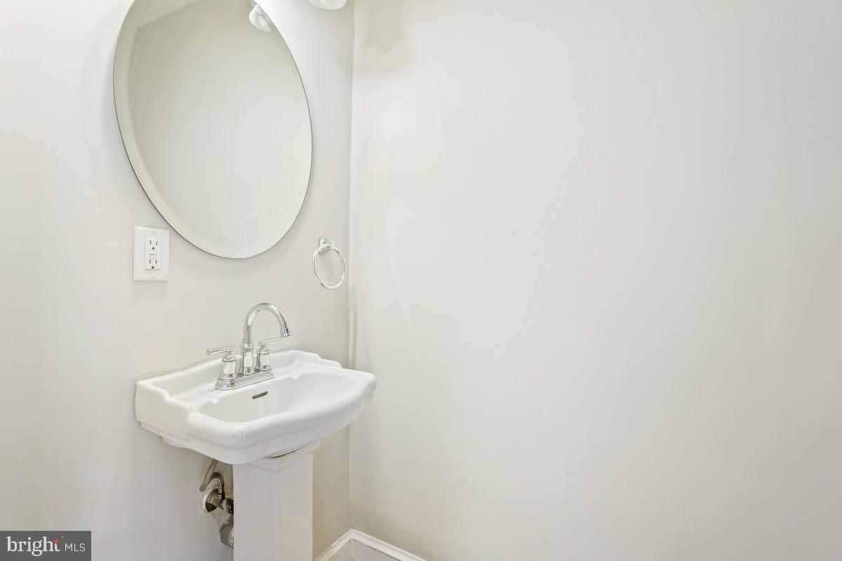 2806 Ivydale Street Silver Spring, MD 20902 - Photo 5 of 29 a bathroom with a sink and a mirror
