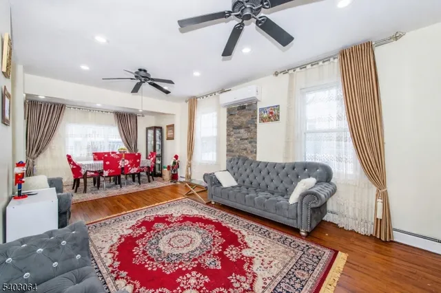 a kitchen with stainless steel appliances granite countertop a stove microwave and sink
