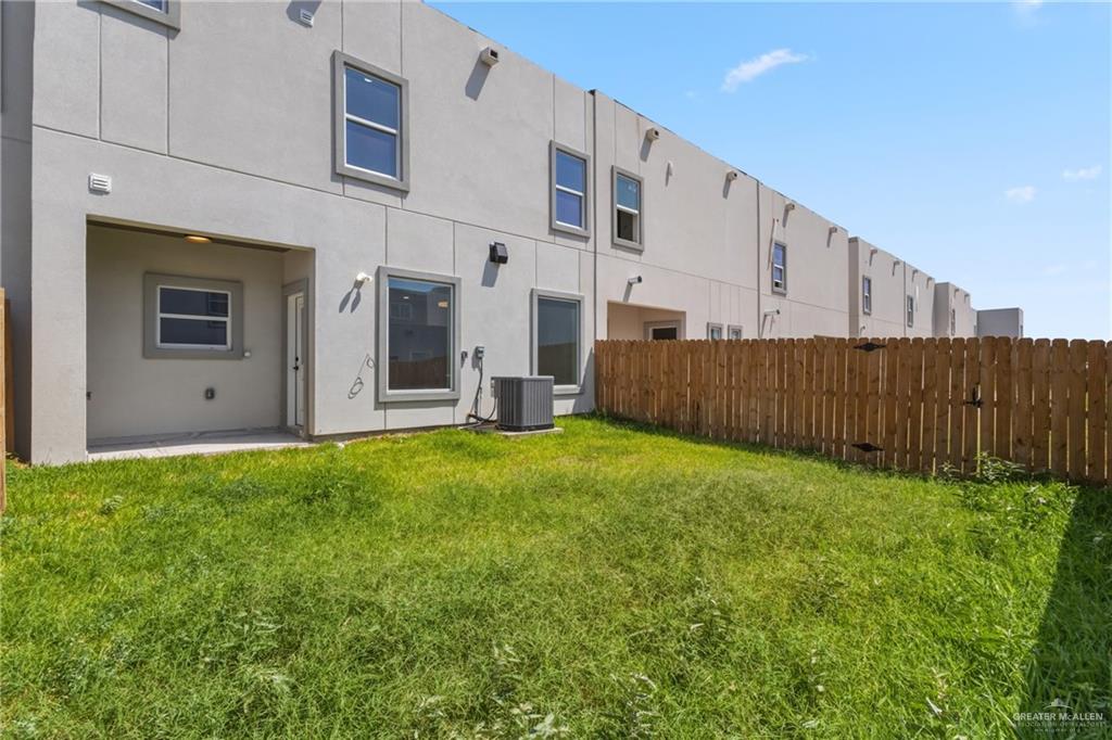 2206 Corales Street Mission, TX 78573 - Photo 17 of 19 a view of an house with backyard space and wooden fence
