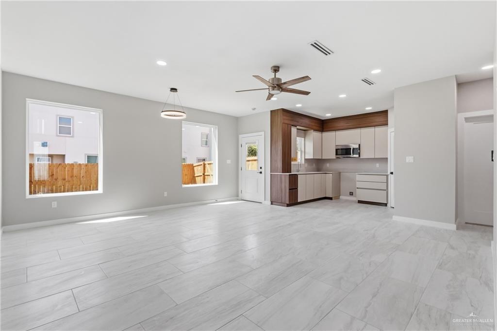 2206 Corales Street Mission, TX 78573 - Photo 2 of 19 a view of a kitchen with a sink cabinets and window