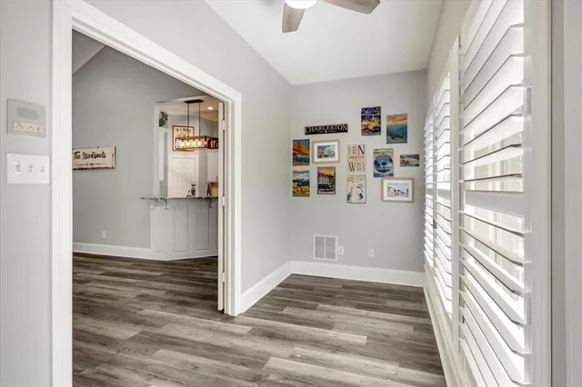 a kitchen with stainless steel appliances granite countertop a sink and a refrigerator