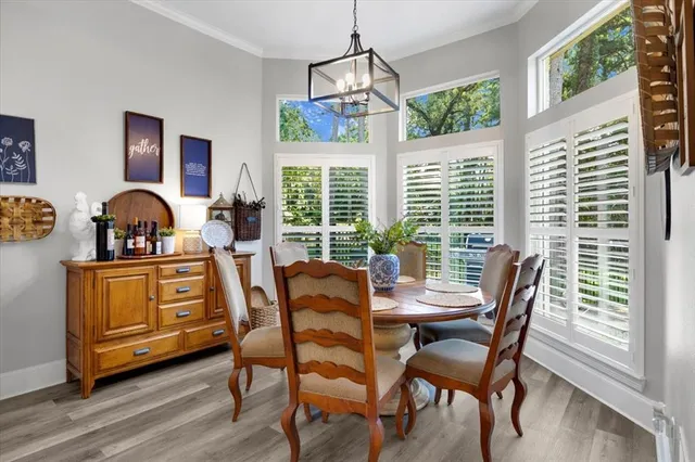 a kitchen with white cabinets a stove and a microwave