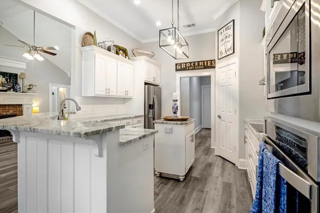 a bedroom with a large bed and a large window