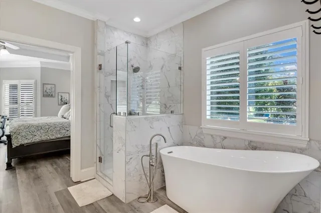 a view of room with wooden floor and fan