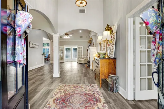 a view of a dining room with furniture wooden floor and chandelier