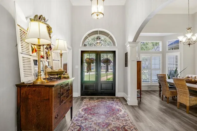 a dining room with furniture and window