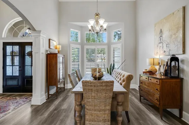 a view of a livingroom with furniture a fireplace and window