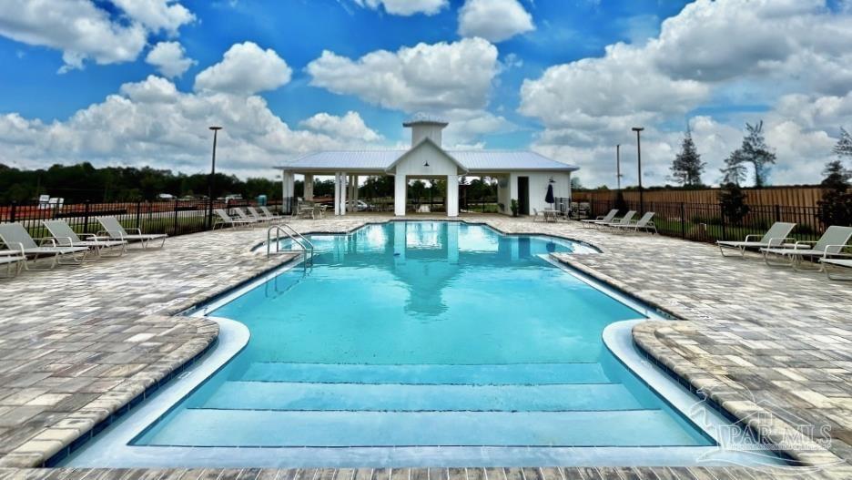 2038 Limpkin Street Cantonment, FL 32533 - Photo 33 of 33 a view of a swimming pool with a patio