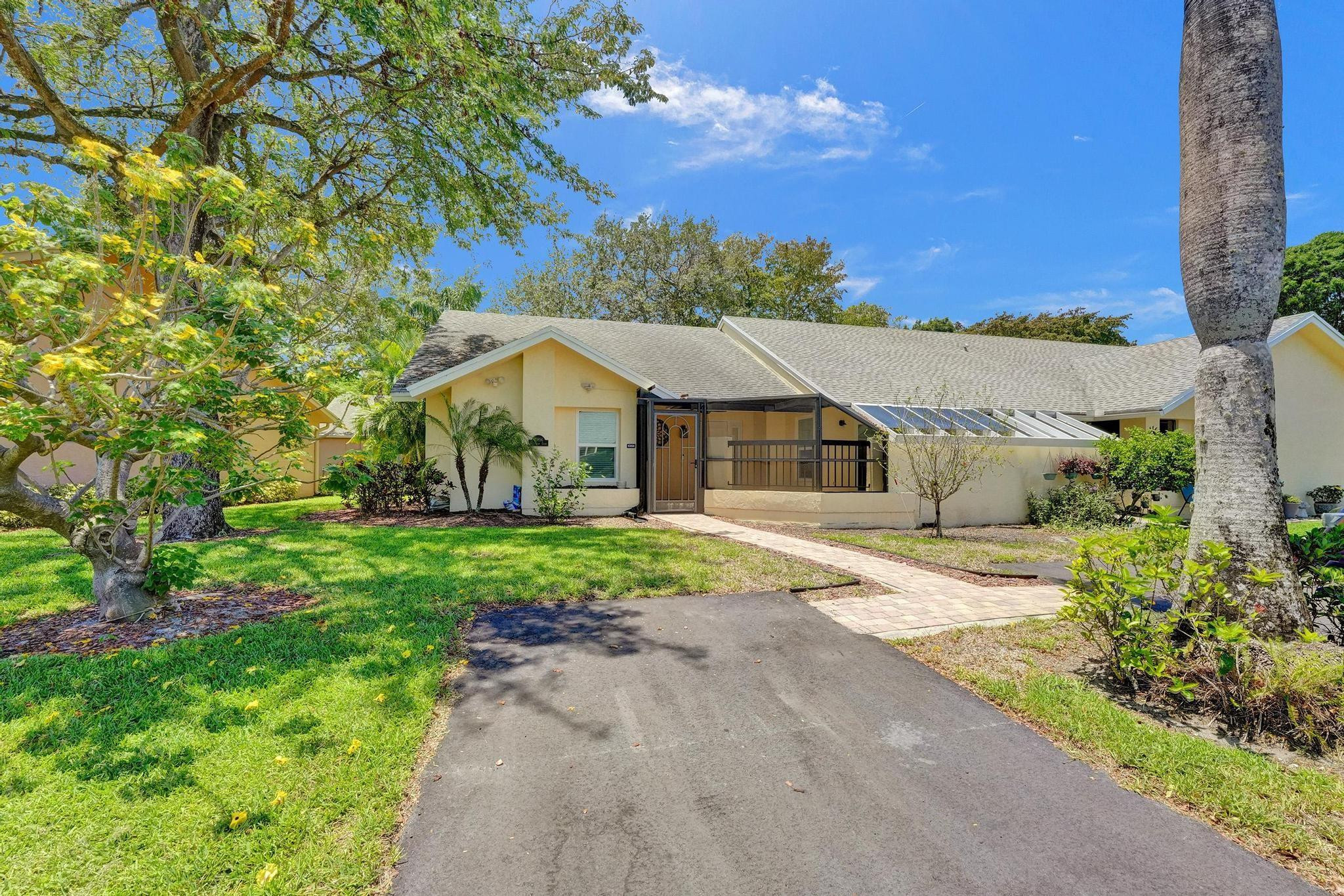 10896 Waterberry Court Boca Raton, FL 33498 - Photo 1 of 34 front view of a house with a yard