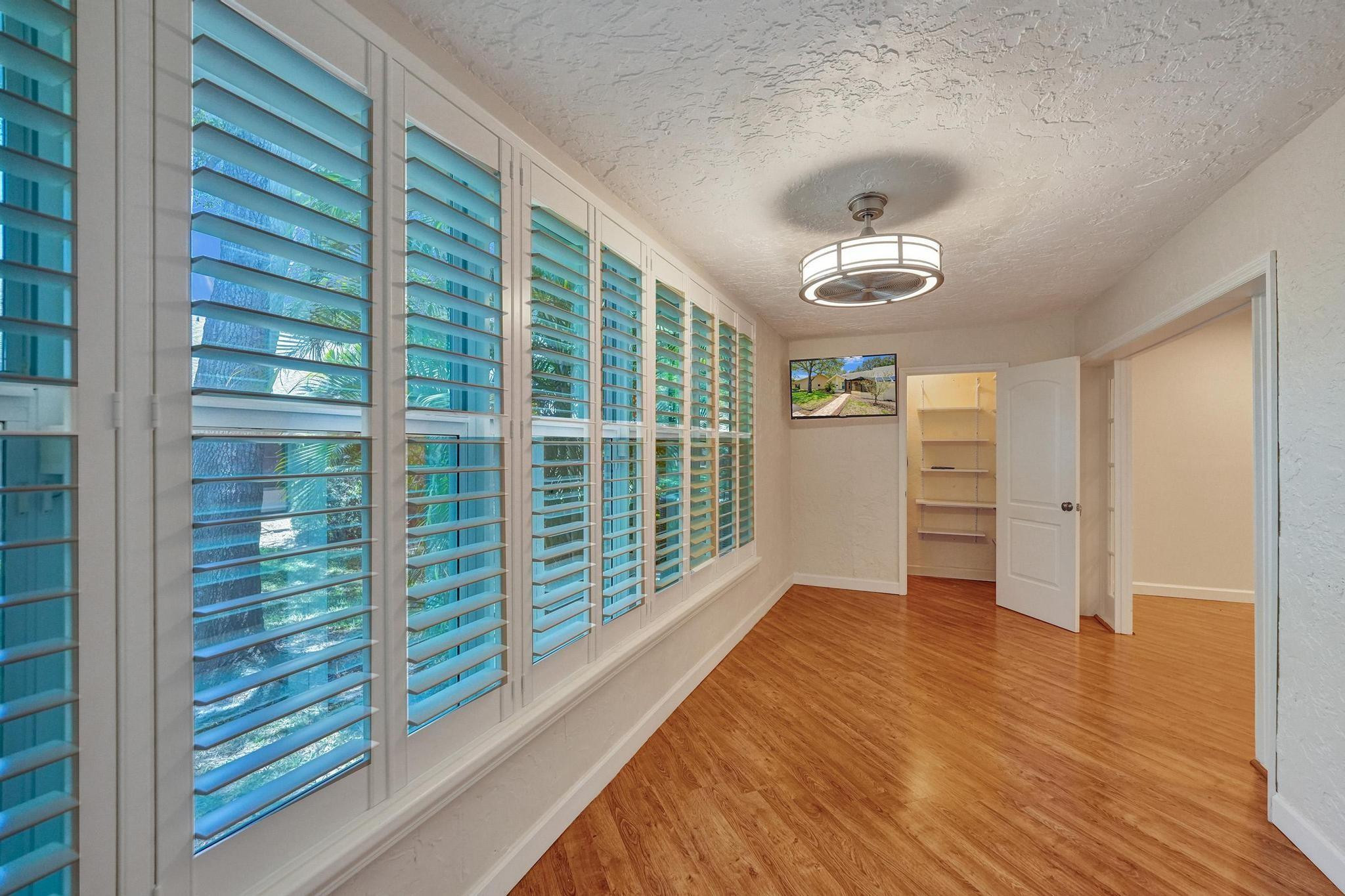 10896 Waterberry Court Boca Raton, FL 33498 - Photo 15 of 34 a view of an empty room with a window
