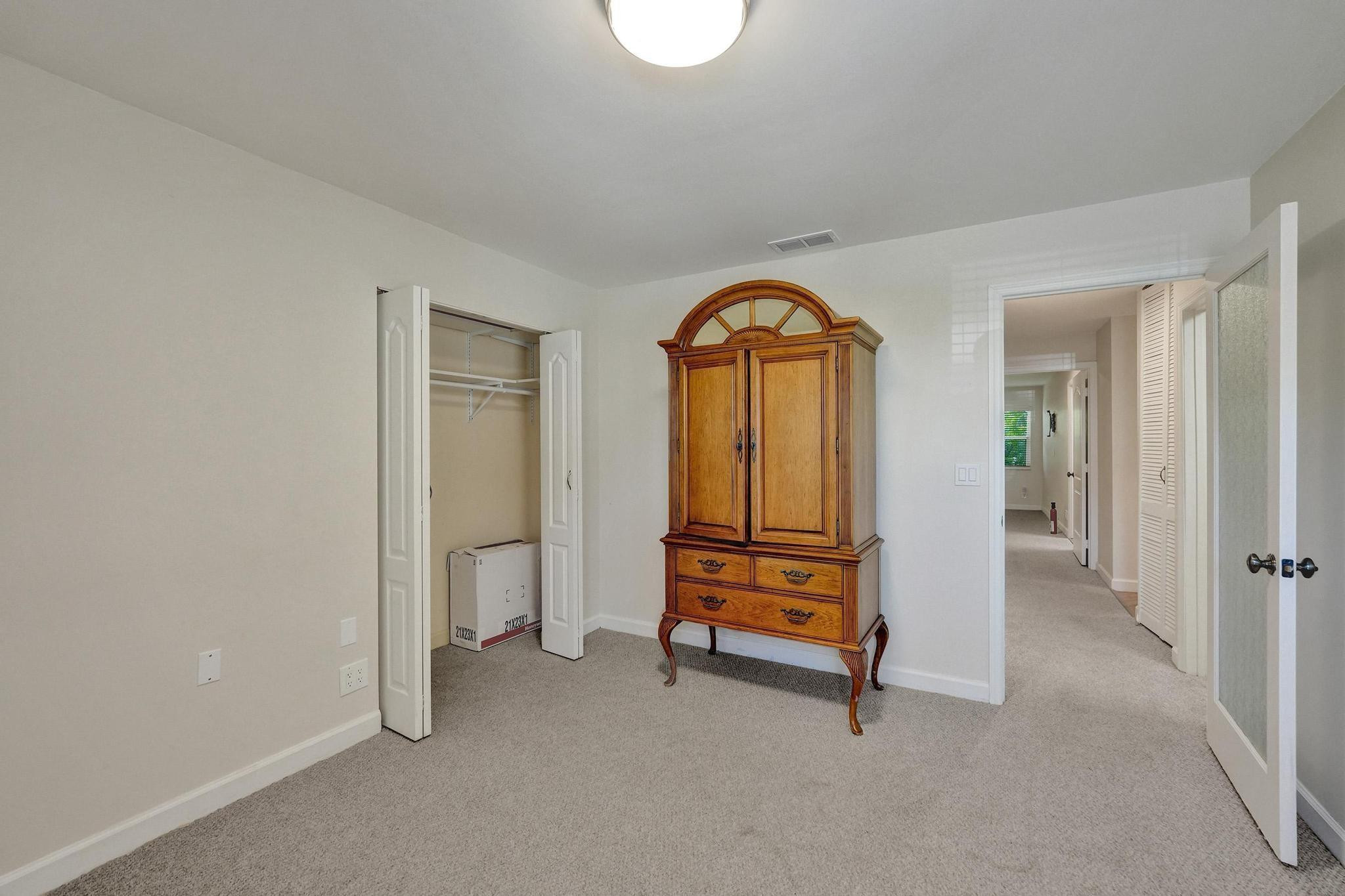 10896 Waterberry Court Boca Raton, FL 33498 - Photo 20 of 34 a view of empty room with wooden floor and air conditioner