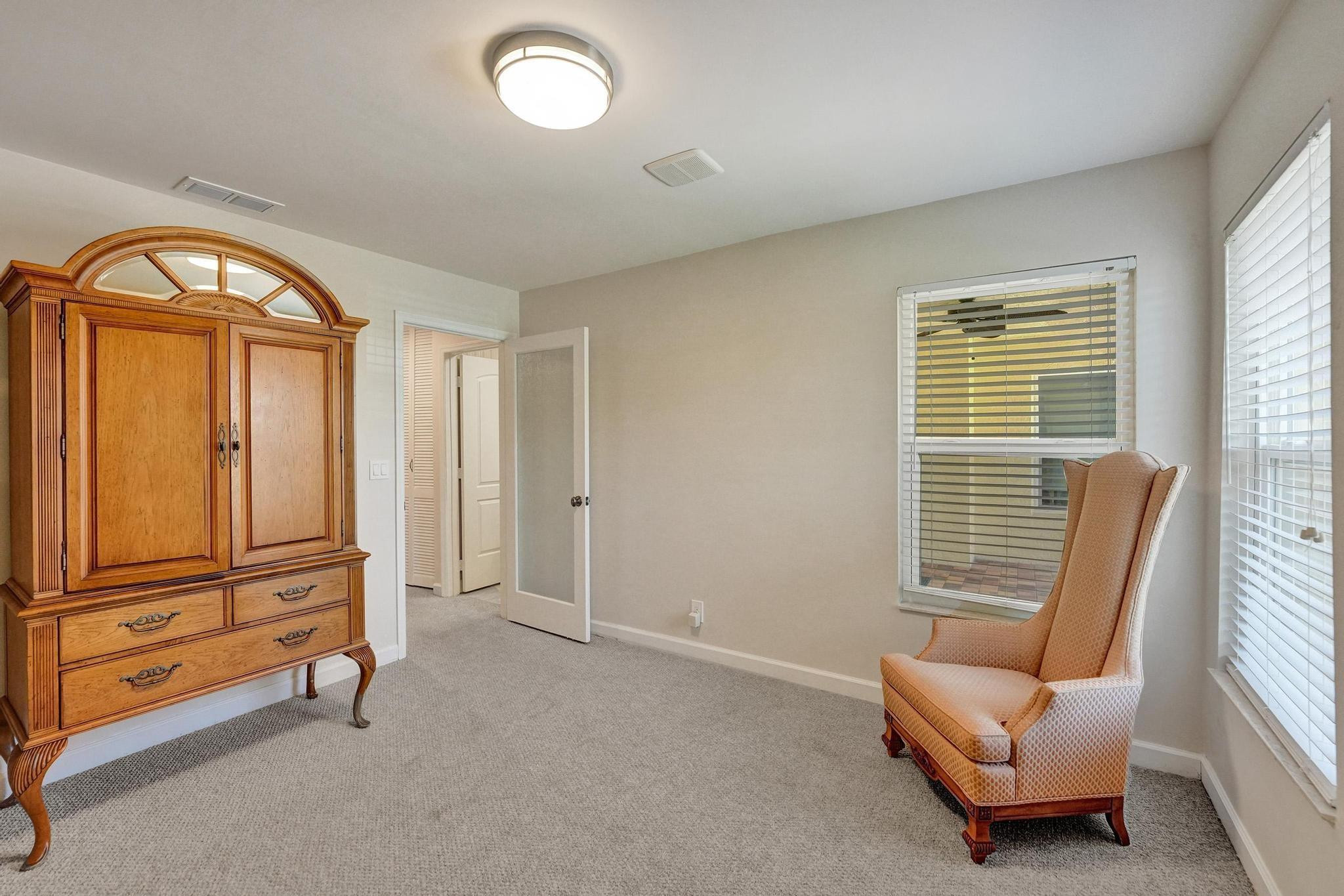 10896 Waterberry Court Boca Raton, FL 33498 - Photo 21 of 34 a living room with furniture and a window