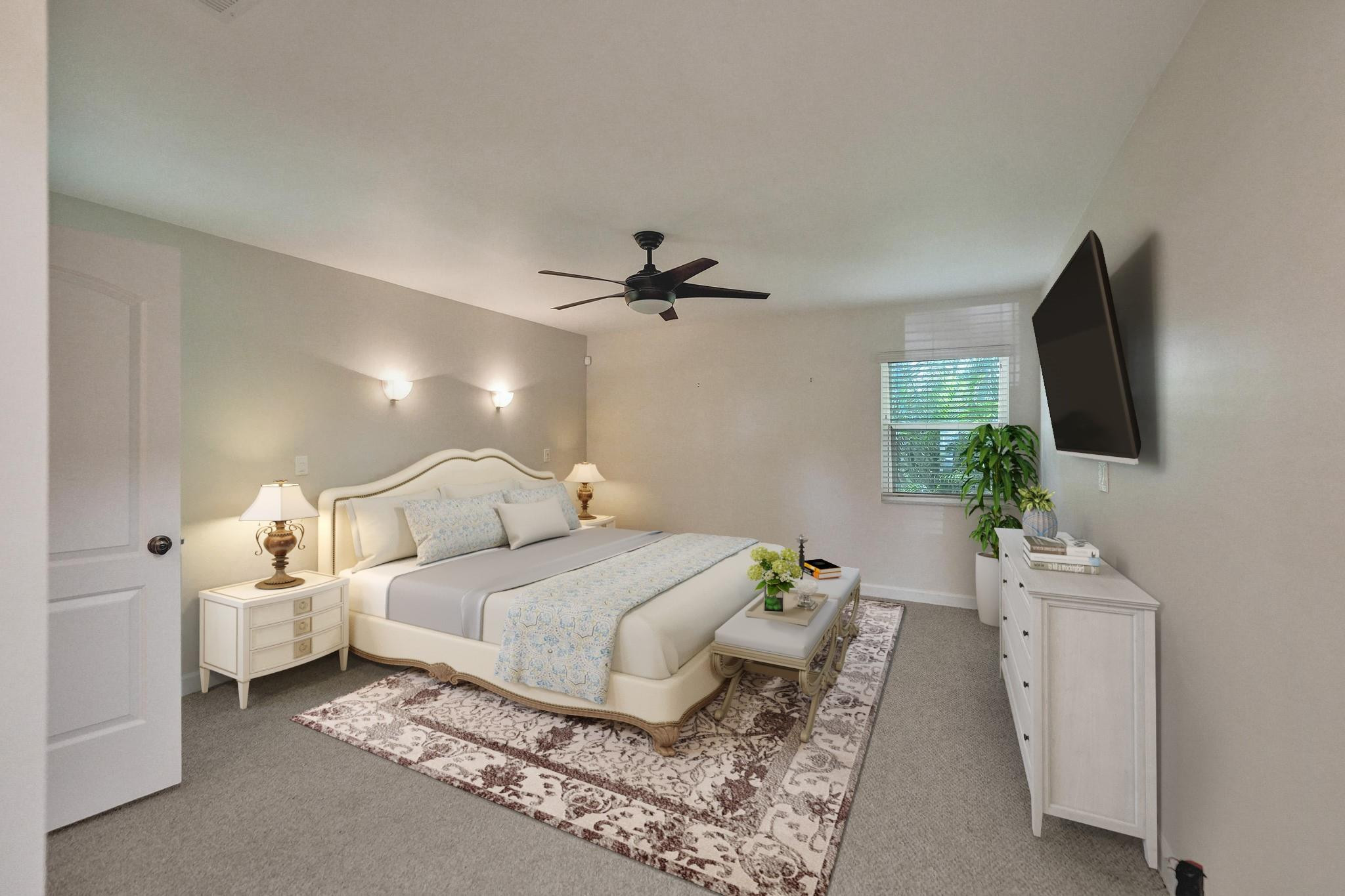 10896 Waterberry Court Boca Raton, FL 33498 - Photo 22 of 34 a bedroom with a bed and a flat screen tv