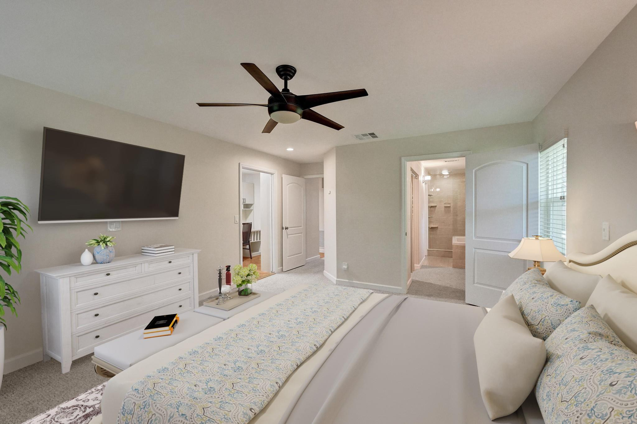 10896 Waterberry Court Boca Raton, FL 33498 - Photo 23 of 34 a spacious bedroom with a bed and a flat screen tv
