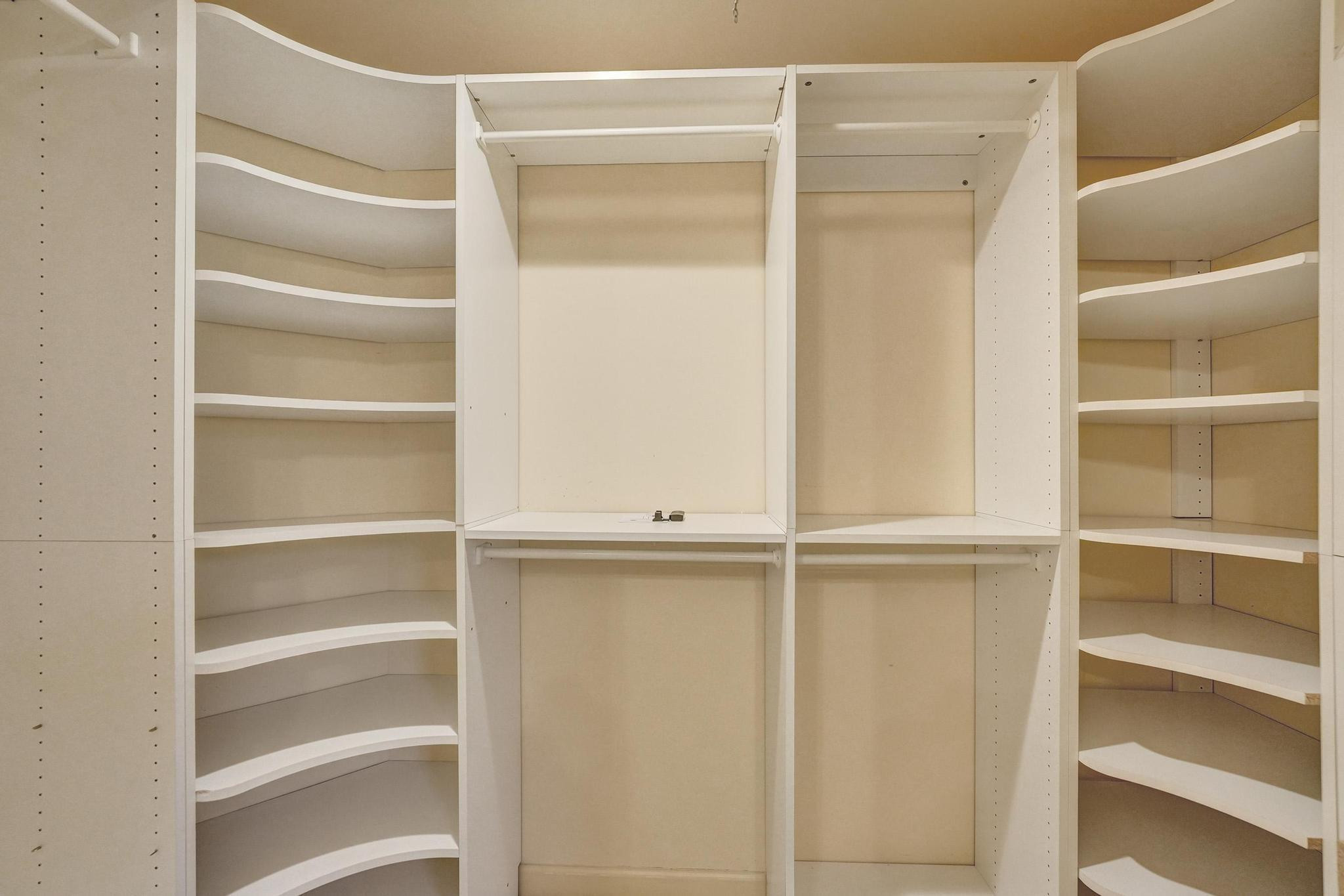 10896 Waterberry Court Boca Raton, FL 33498 - Photo 25 of 34 a view of walk in closet with empty racks
