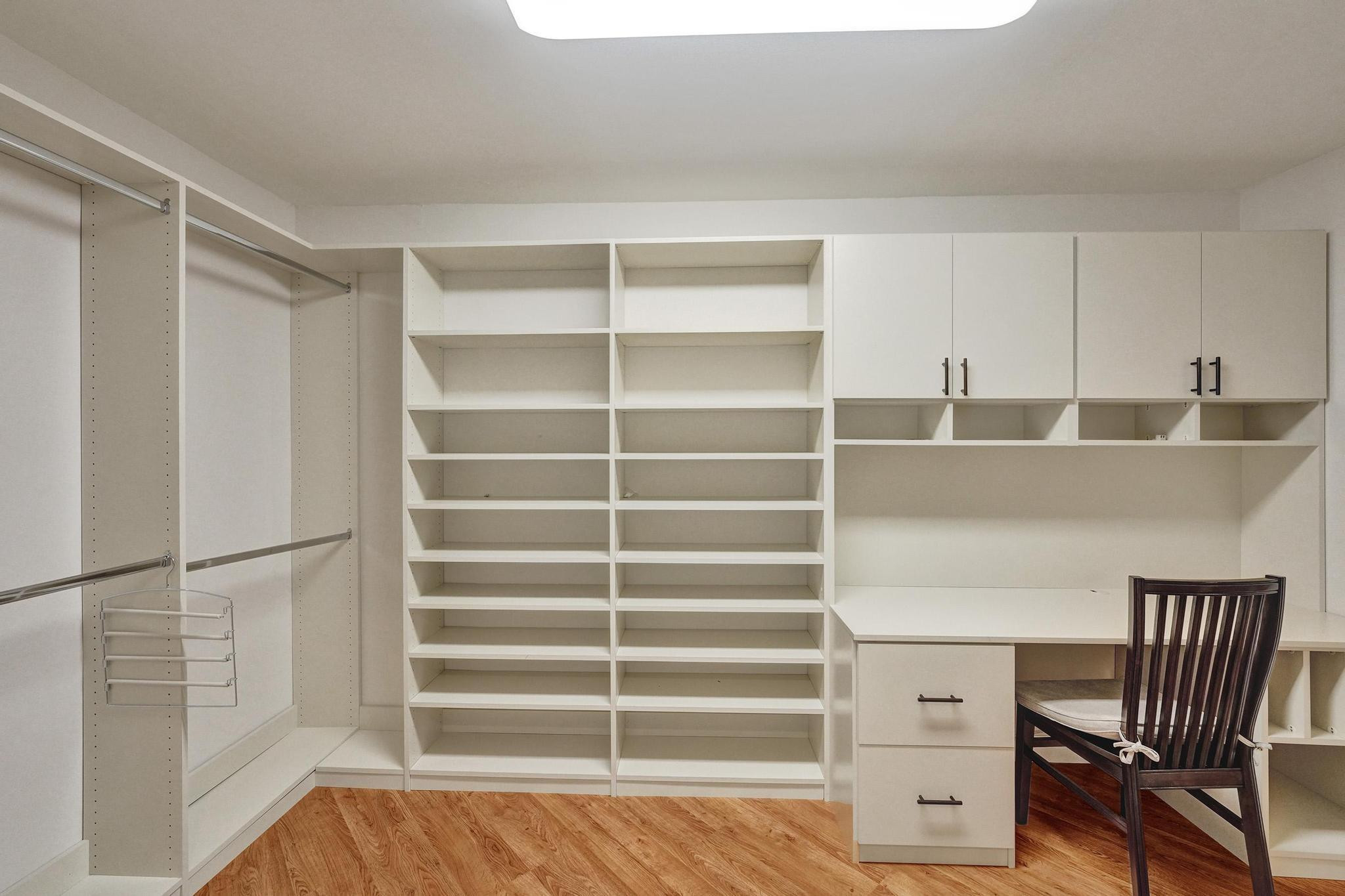 10896 Waterberry Court Boca Raton, FL 33498 - Photo 29 of 34 a view of cabinets and wooden floor