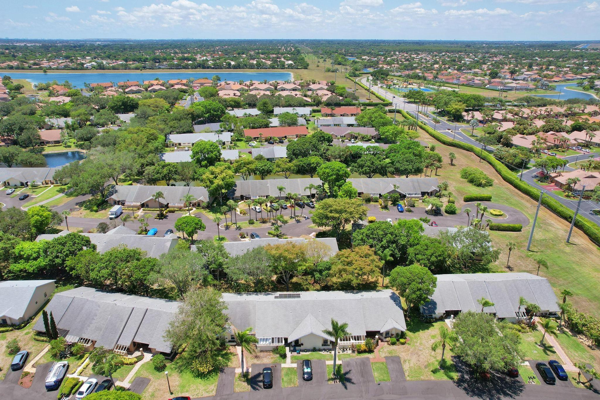 10896 Waterberry Court Boca Raton, FL 33498 - Photo 3 of 34 an aerial view of a city with lots of residential buildings