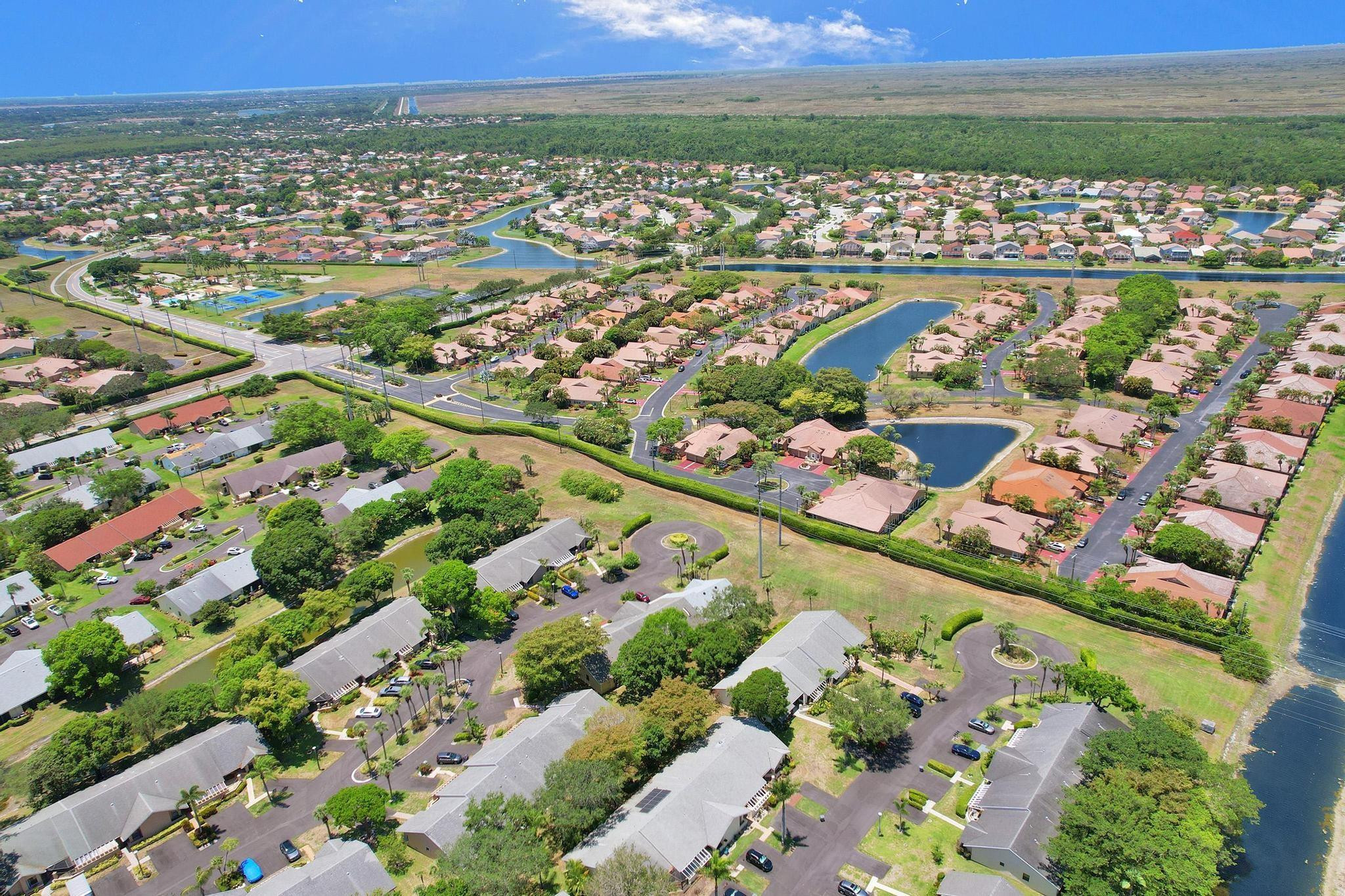 10896 Waterberry Court Boca Raton, FL 33498 - Photo 32 of 34 a view of a city with an ocean