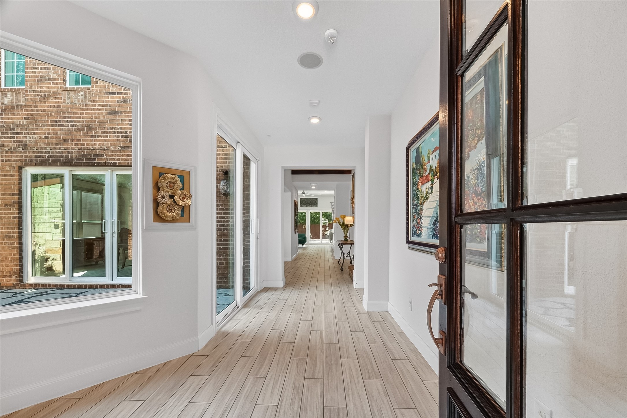 51 Scepter Ridge Sugar Land, TX 77498 - Photo 7 of 46 a view of a hallway with wooden floor and staircase
