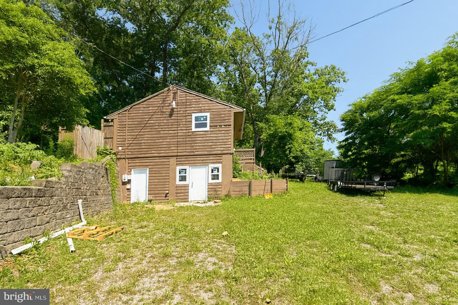 7699 Hedgesville Road Hedgesville, WV 25427 - Photo 2 of 47 a house view with a outdoor space