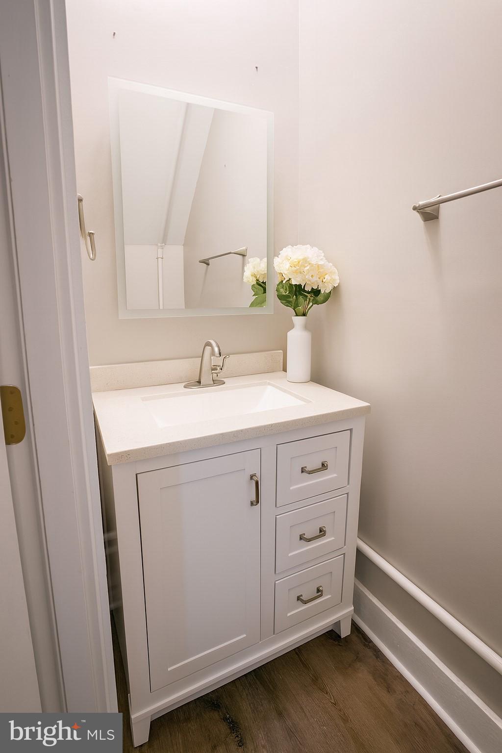 7699 Hedgesville Road Hedgesville, WV 25427 - Photo 37 of 47 a bathroom with a sink vanity and mirror