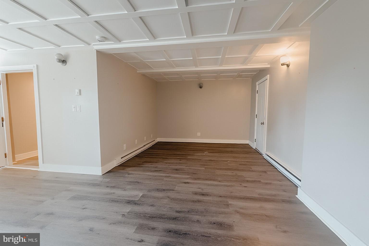 7699 Hedgesville Road Hedgesville, WV 25427 - Photo 38 of 47 an empty room with wooden floor