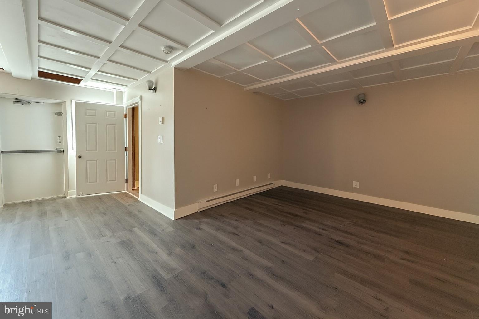 7699 Hedgesville Road Hedgesville, WV 25427 - Photo 43 of 47 a view of an empty room with wooden floor and a window