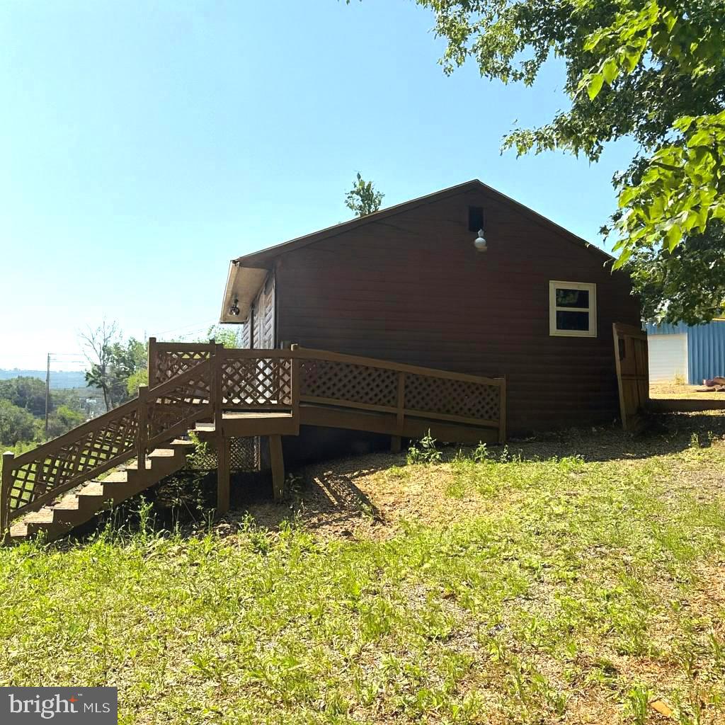 7699 Hedgesville Road Hedgesville, WV 25427 - Photo 46 of 47 a backyard of a house with lots of green space