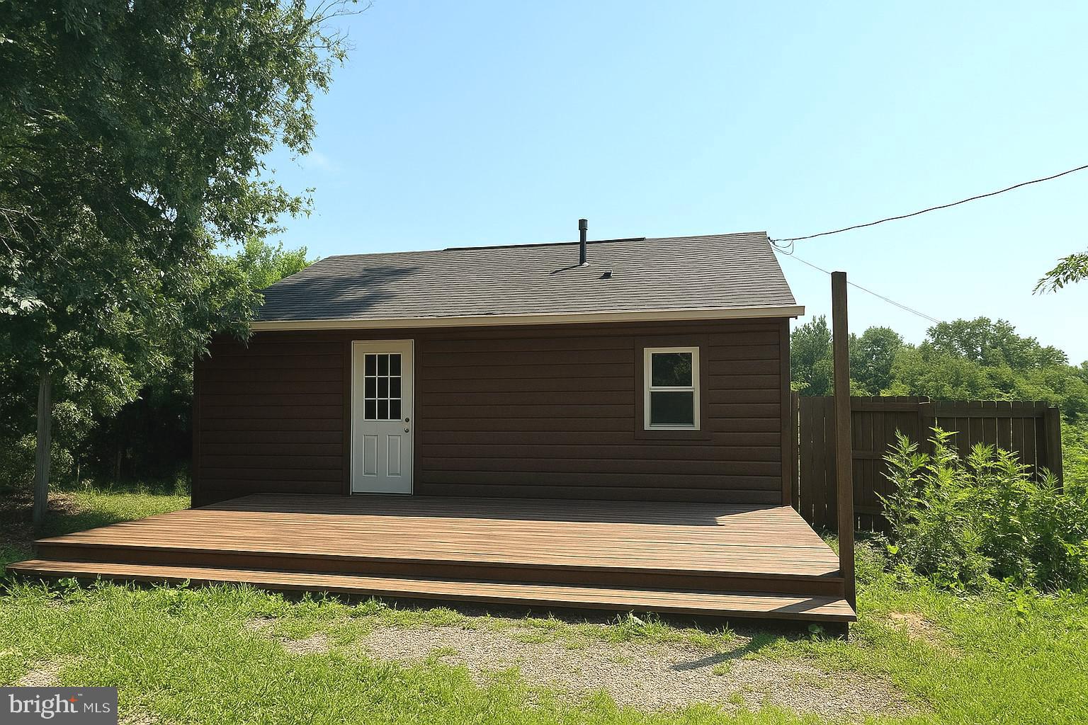 7699 Hedgesville Road Hedgesville, WV 25427 - Photo 6 of 47 a front view of a house with a yard