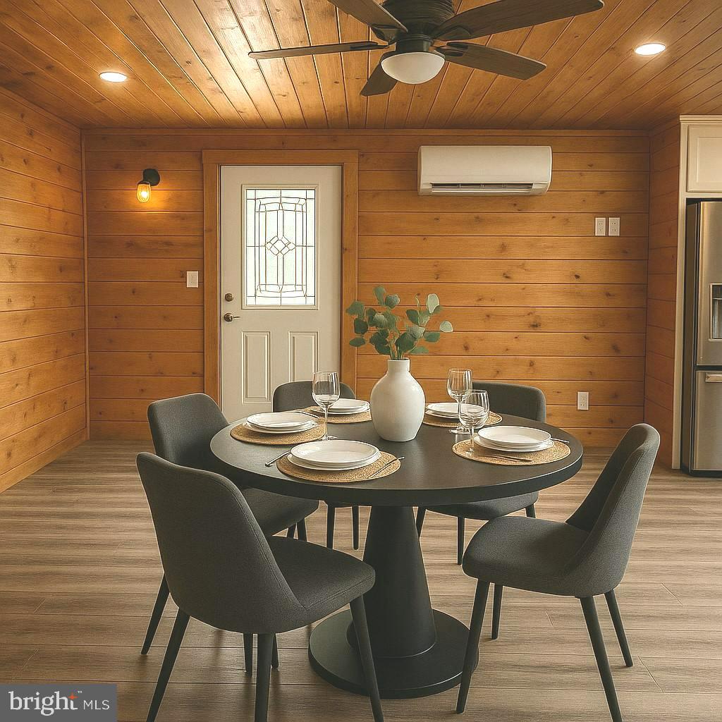 7699 Hedgesville Road Hedgesville, WV 25427 - Photo 8 of 47 a view of a dining room with furniture and wooden floor