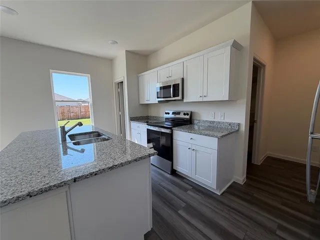 a bathroom with a sink and shower