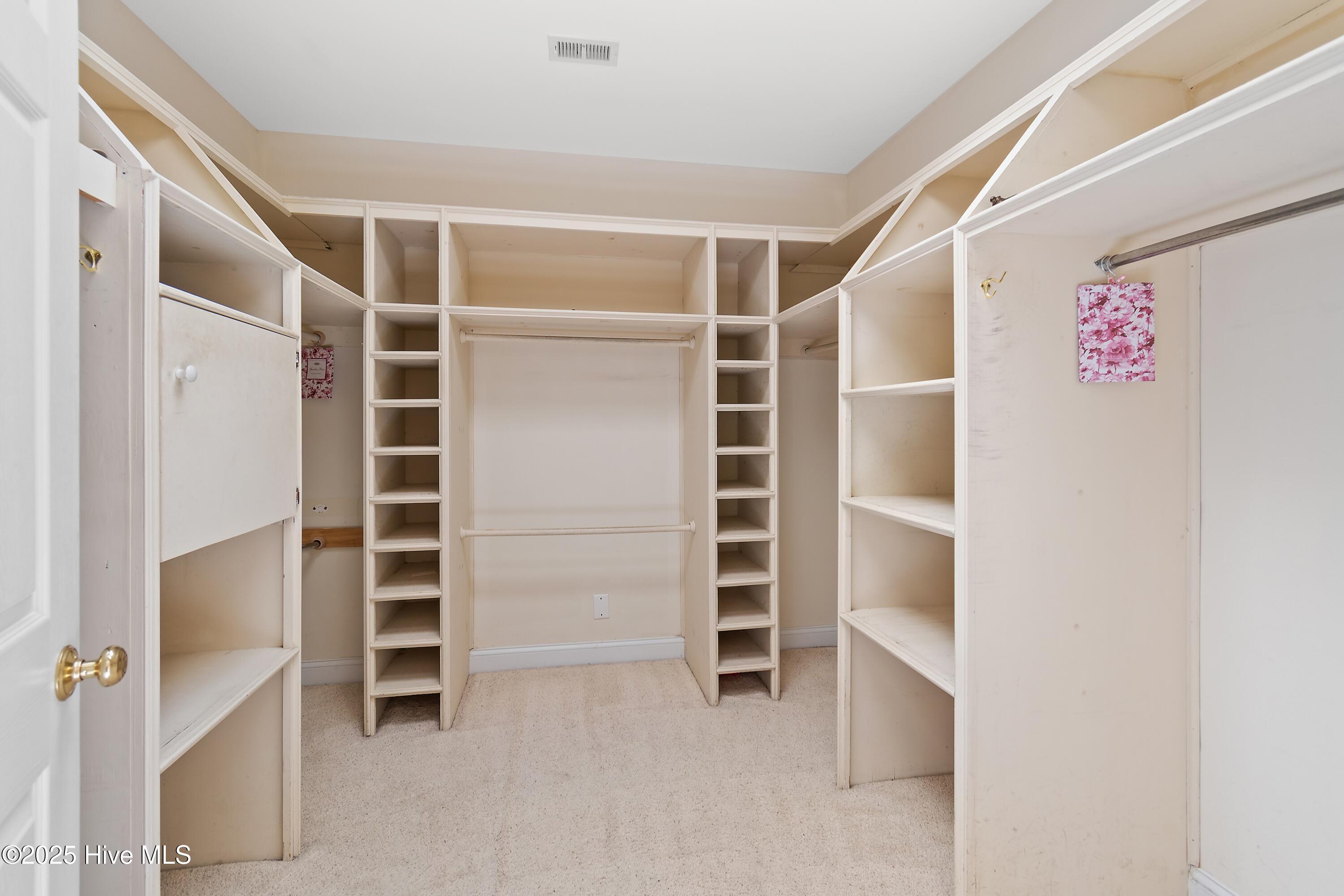 6777 Roberta Road Southwest Ocean Isle Beach, NC 28469 - Photo 50 of 89 Large Master closet with large amount of build ins... a Dream master Closet