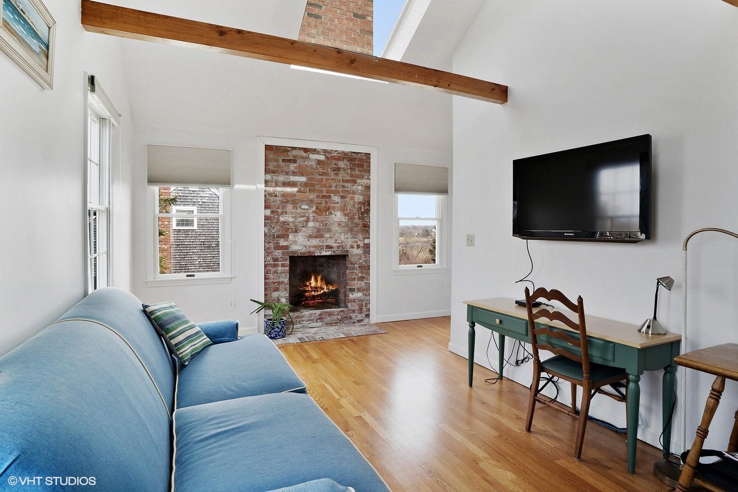 151 Harbor Point Road Cummaquid, MA 02675 - Photo 7 of 14 a living room with furniture and a flat screen tv