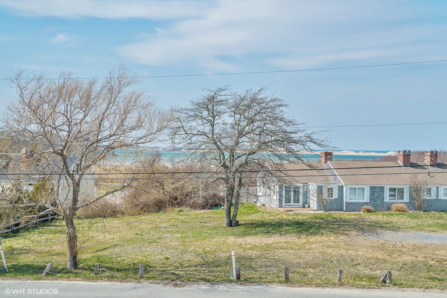 151 Harbor Point Road Cummaquid, MA 02675 - Photo 9 of 14 a view of a big yard with large tree