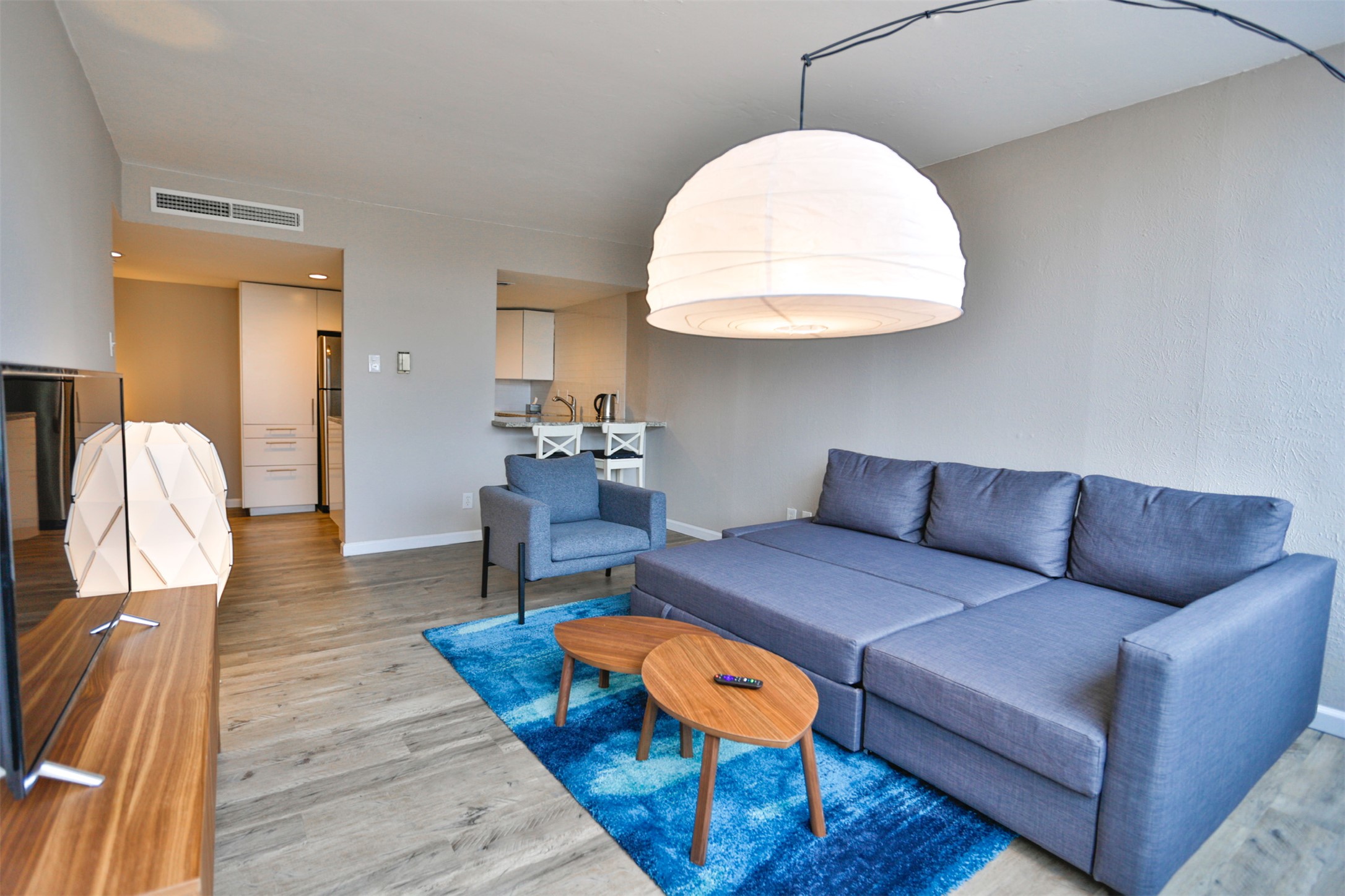 1800 Lavaca Street, Unit A608 Austin, TX 78701 - Photo 7 of 12 Living room with light wood-style flooring and baseboards