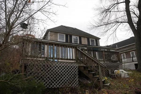 a front view of a house with a large window